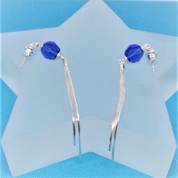 Sleek Swarovski Blue Pom Pom Earrings with Tassel