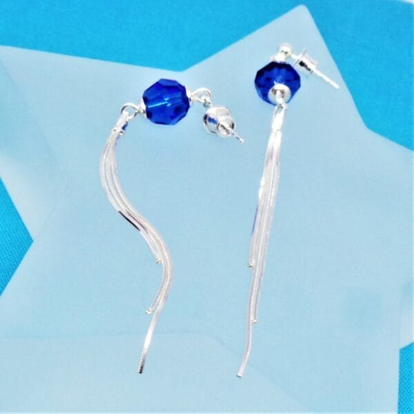 Sleek Swarovski Blue Pom Pom Earrings with Tassel