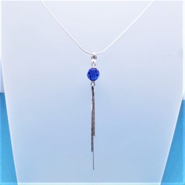 Sleek Swarovski Blue Pom Pom Necklace with Tassel